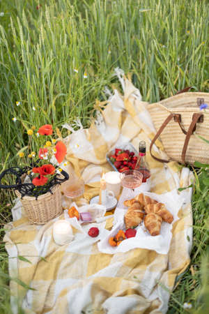 Beautiful breakfast picnic on the field with poppiesの写真素材