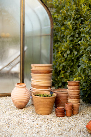 Empty clay pots ready for planting in garden outdoorsの写真素材