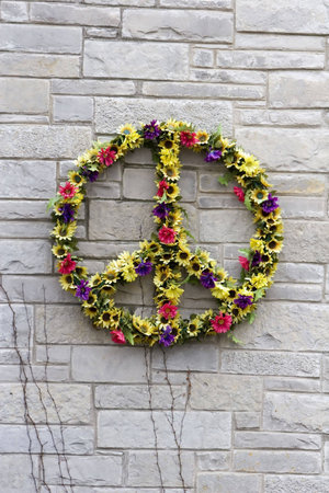 Peace Flower Wreath on a brick wallの写真素材