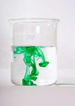 Green Swirls in water, showing fluid dynamicsの写真素材