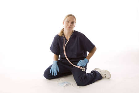 Young blond woman in medical scrubsの写真素材