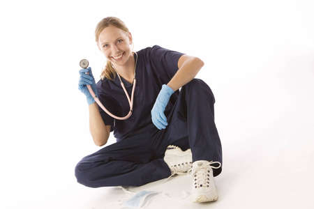 Young blond woman in medical scrubsの写真素材