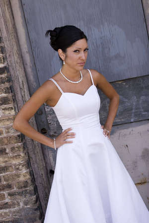 Bridal portrait outdoor with brunette in wedding dressの写真素材