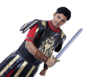 Adult Male Indian Model dressed as Roman Soldier over white backgroundの写真素材