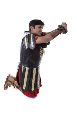 Adult Male Indian Model dressed as Roman Soldier over white backgroundの写真素材