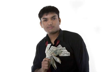 Male model with cash over white backgroundの写真素材