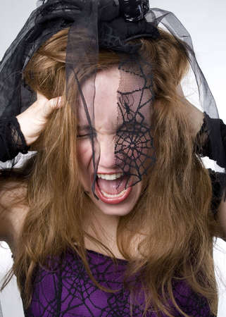 Brunette Model in Goth clothing over white backgroundの写真素材