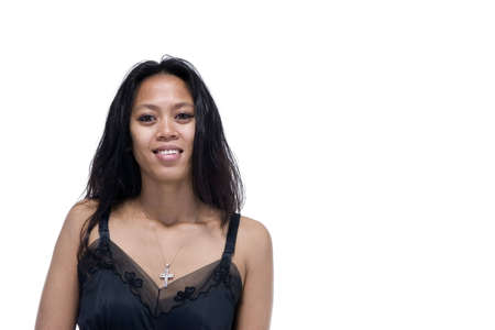 Brunette in black evening dress over a white backgroundの写真素材