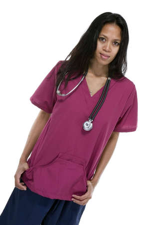 Brunette in medical scrubs over white backgroundの写真素材
