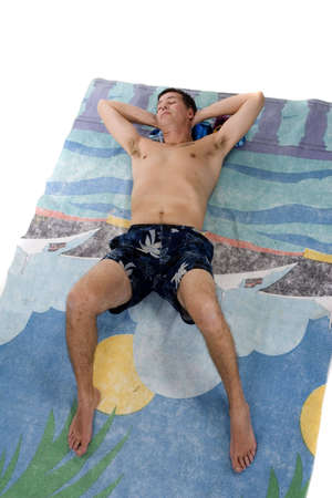 Adult male in swimming suit and beach towelの写真素材