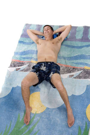 Adult male in swimming suit and beach towelの写真素材