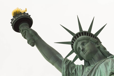 Statue of Liberty Close up on Face and arm against white backgroundの写真素材
