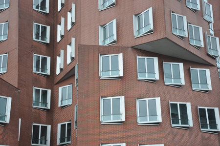 Interlocking clinker facade of the Gehry buildings at the Media Harbor in Dusseldorf, Germanyのeditorial素材