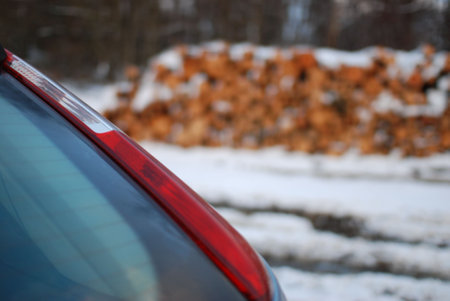 Closeup shot of the red tail light on a gray carの写真素材
