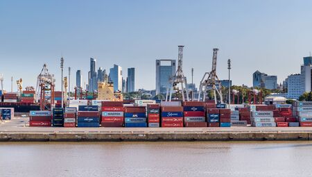 Buenos Aries / Argentina - January 19, 2020. Cargo containers moved by cranes are stacked around Puerto Madero awaiting shipping to other countries .のeditorial素材