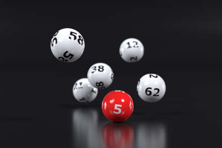Lottery balls with numbers falling in 3dの写真素材