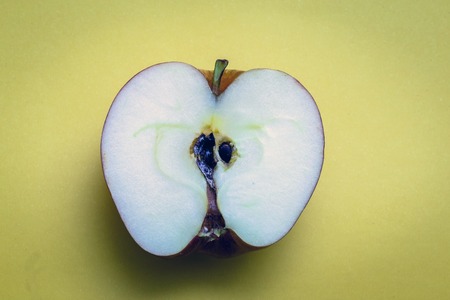 Apple cut in half. High resolution photo of a large, juicy red apple cut in half.の写真素材