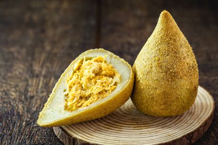 fried salted chicken meat called "Coxinha" in Brazil, snacks from traditional Brazilian cuisine stuffed with shredded chicken.の写真素材