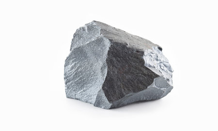 Iron ore isolated on the white background. Iron ore are rocks and minerals from which metallic iron...
