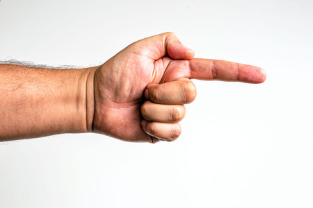 male hand on isolated white background, pointing sideways, indicating direction
