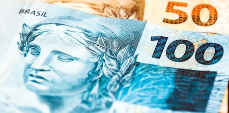Money banknotes of Brazil, Brazilian Real. One hundred, fifty, twenty, ten, five and two reais notes. Queued. Economy concept.の写真素材