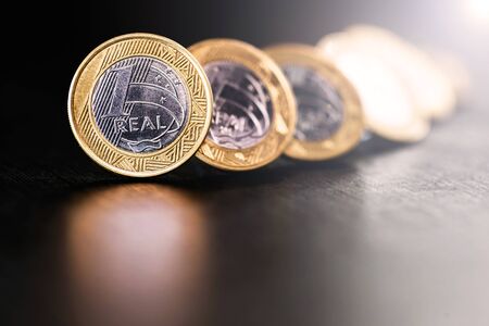 one real coin and gold bars. Concept of appreciation of the Brazilian currency in the stock market.の写真素材
