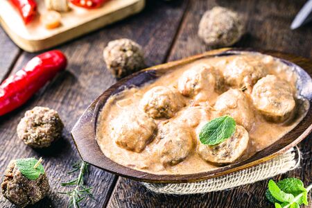 Vegetarian meatballs with white sauce of herbs and chopped vegetables. Meatless vegan food with organic products.の写真素材