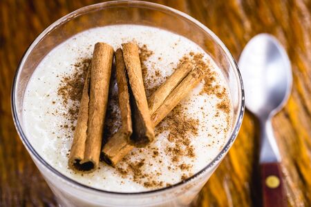 Creamy rice pudding sprinkled with cinnamon, typical Brazilian dessert.の写真素材