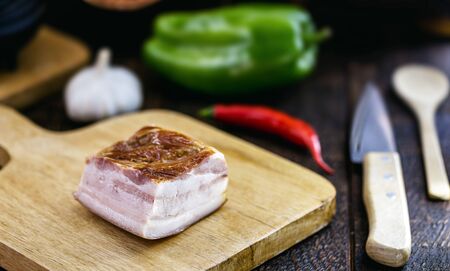 pork known as "toicinho or toucinho", used as a culinary ingredient. Rustic cuisine, with vegetables in the background. Food made in minas gerais, brazil.の写真素材