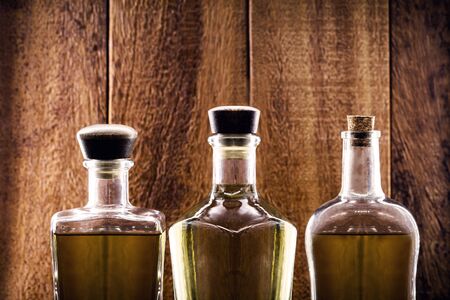 three bottles of high quality distilled alcohol. Brazilian silver cachaÃ§a, called pinga, vodka, white rum, liqueur, pure drink, PoitÃ­n, cognac or absinthe.の写真素材