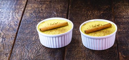 homemade corn candy, porridgeknown in Brazil as Curau, with cinnamon powder and cinnamon bark,...