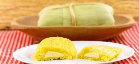 Pamonha, Brazilian sweet corn with cheese filling. Pamonha typical of Brazil, food of the state of minas gerais and goiais. Concept of traditional food. Brazilian food at rural parties in June and July.の写真素材