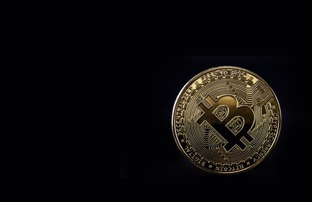 digital currency, Bitcoin, decentralized cryptocurrency, electronic money for point-to-point transactions. Coin isolated on black backgroundの写真素材