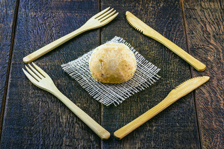 Brazilian cheese bread, vegan, without cheese, made with potatoes, with environmentally friendly bamboo cutlery.の写真素材
