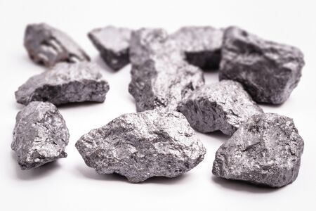 Silver nugget isolated on white background, raw gemstone. Concept of luxury, rarity.の写真素材