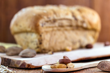 homemade bread, made from Brazil nuts and walnuts, with oats and flaxseed. Export product, Brazilian cuisine. Bottom wooden table, healthy cooking concept.の写真素材