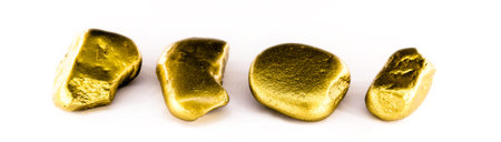 gold nuggets on white background isolated. High resolution photo of gold stones. Concept of luxury...