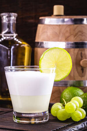 Pisco sour, a typical cocktail of South American cuisine, Peru and Chile, prepared based on pisco and lemon, sweetened with brandy, eggs, served cold.の写真素材