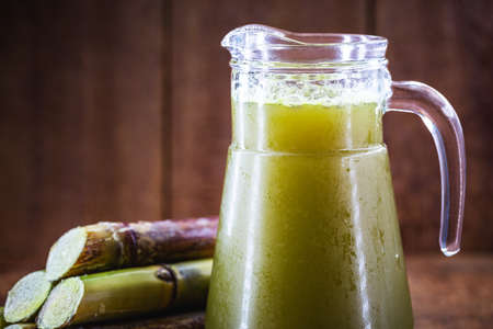 Sugar cane juice or garapa is the liquid extracted from sugar cane in the milling process. Typical drink from Brazil. organic and natural.の写真素材