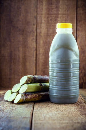 Cane juice or garapa, in plastic bottle. organic drink extracted from sugar cane milling.の写真素材