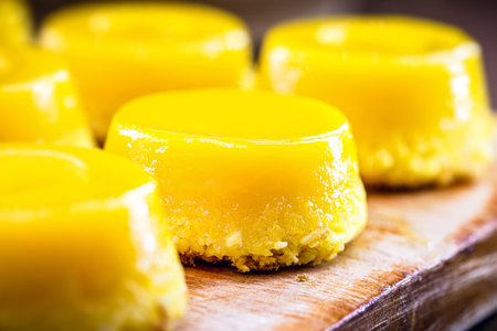 Brazilian quindim is a sweet made from egg yolk, sugar and grated coconut. Correspondds to the...