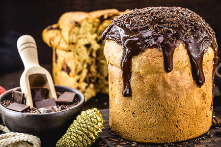 homemade panettone covered in chocolate and sprinkles, called chocotone. Christmas bread served as dessert, stuffed and covered in chocolateの写真素材