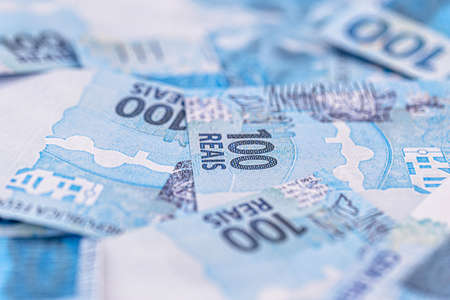 one hundred Brazilian reais banknotes thrown, fallen, concept of brazil's financial crisis and recession or inflationの写真素材