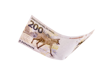 two hundred reais banknote, in free fall, money rain with white background. One-off focus, concept...