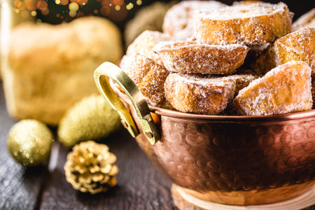 French toast, typical Brazilian dessert for Christmas in copper pot. Fried bread jam with sugar and...