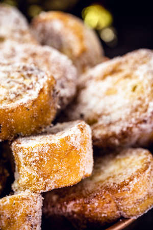 French toast, called "rabanada" typical Brazilian dessert for Christmas in copper pot. Christmas party concept, sweet New Year.の写真素材