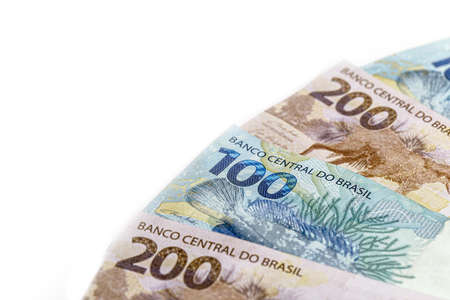 banknotes of 100 and 200 reais, money from brazil. Concept of Brazilian economy, economic growthの写真素材