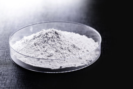 Calcium carbonate, the result of the reaction of calcium oxide with carbon dioxide. Being prepared in petri dishの写真素材