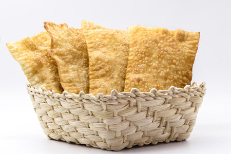 Brazilian pastry, traditional pasta called meat pastry on isolated on white background, copyspaceの写真素材