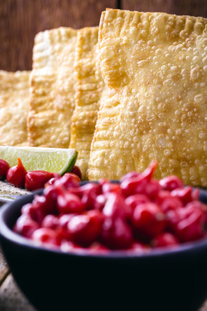 Brazilian pastry, fried and stuffed with ground meat and potatoes, hot sauce served hot.の写真素材
